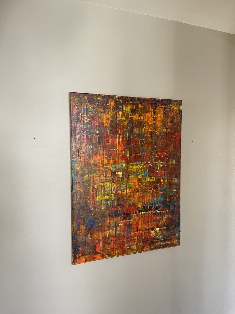 Photo of a painting on the wall by artist Steve Loya.