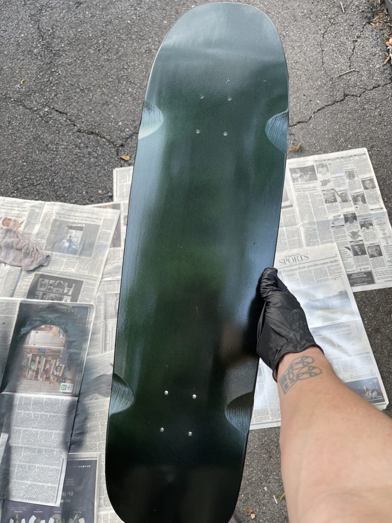 Green Purple Paint application on skateboard
