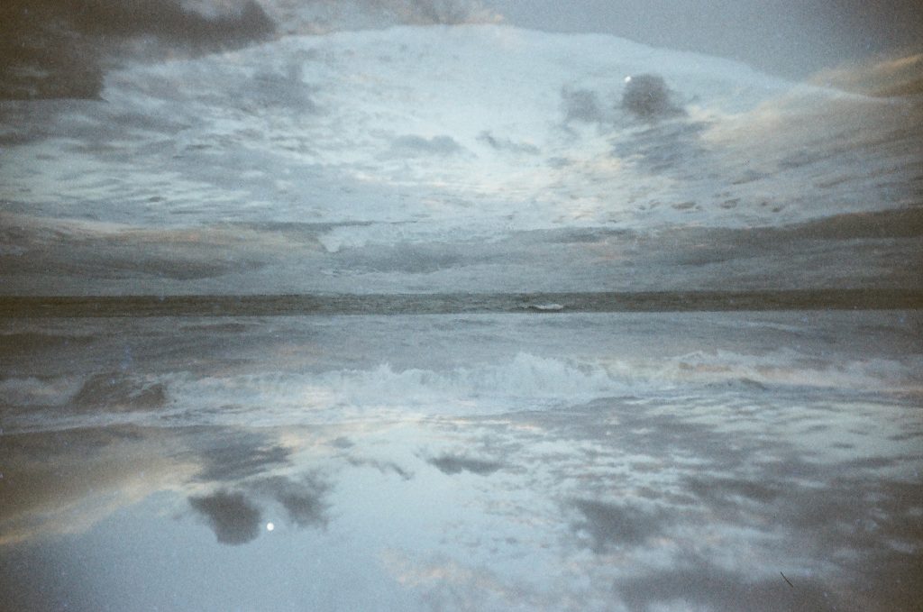 Ocean waves and sky double exposure